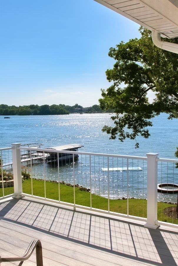 View from the deck over the railing to the pier and open water