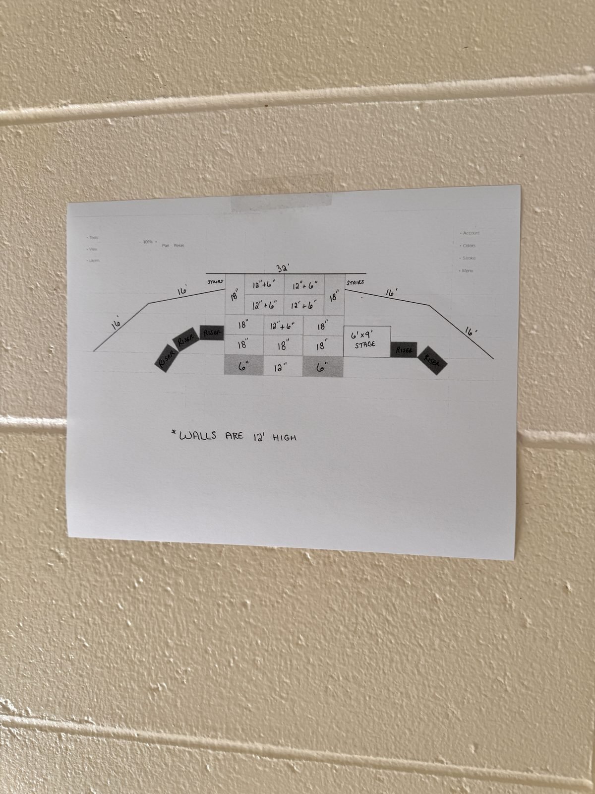 The stage layout plan taped to the gym wall