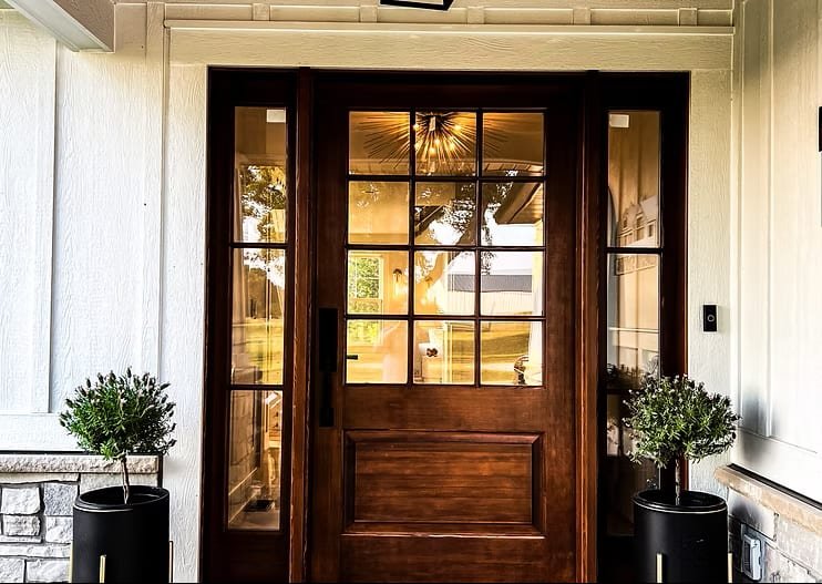 Custom stained wood entry door with divided glass