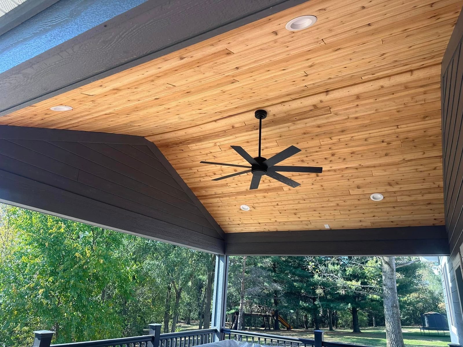 Cedar tongue-and-groove porch ceiling with ceiling fan